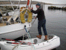 Thies Matzen from S/Y Wanderer III testing the stability of a Portland Pudgy safety dinghy